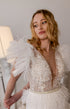 Pearl short wedding dress: Mini reception gown with feathers on the waist and ruffles