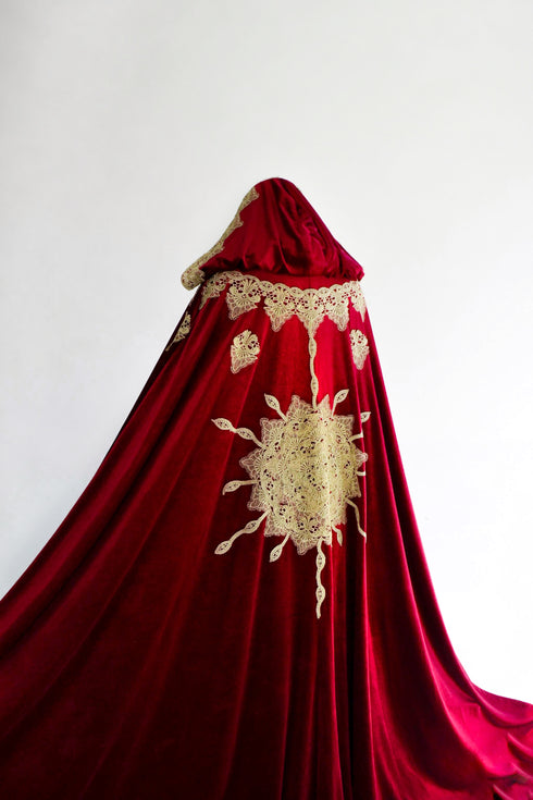 Red cape with a sun